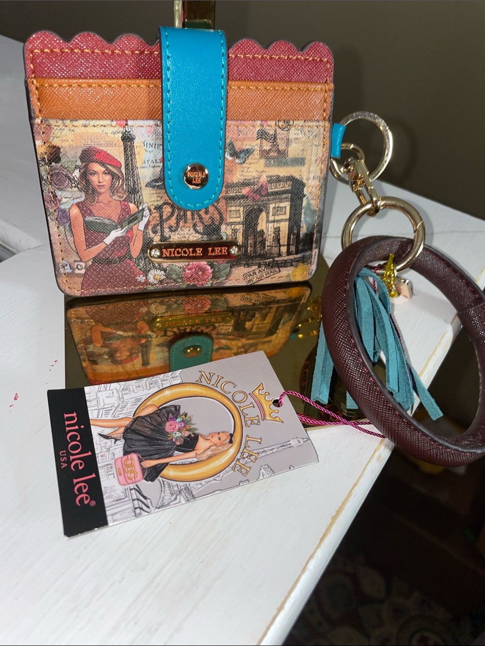 Nicole Lee Multicolor Paris Print Wallet with Teal Strap and Tassel Keyring